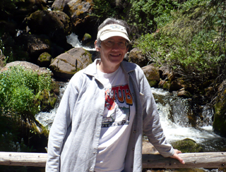 Barb on bridge in front of falls