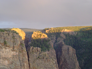 Sun coming down over canyon